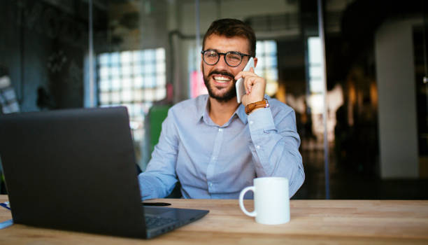 istock Business person smiling and talking on phone 1062926464