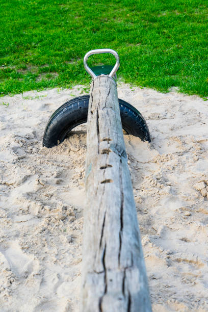 istock wooden pole used as seesaw 1062927410