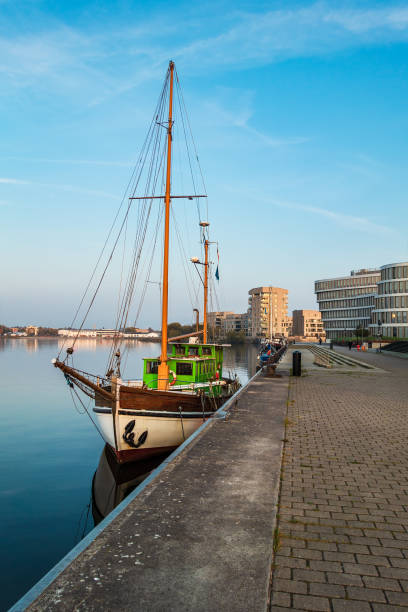 istock Sailing ship and modern buildings in Rostock, Germany 1062932368