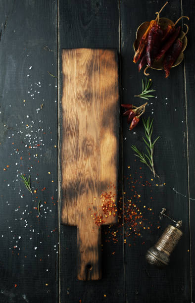 istock Cutting wooden board with spices 1062932780