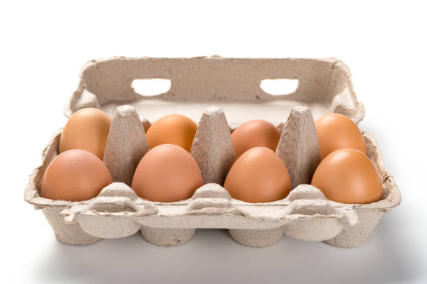 istock fresh eggs in a paper package close up on white 1062933140