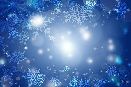 Abstract blue and white Christmas background with snowflakes, snow fall and bokeh. Abstract Christmas background