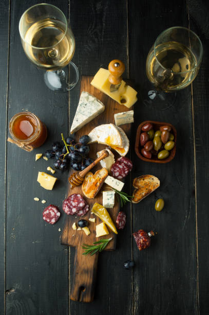istock Assorted cheeses with grapes, nuts and rosemary 1062933290