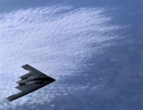 The Northrop B-2 Stealth Bomber approaches a A KC-10A Tanker from McGuire Air Force Base, New Jersey for mid-air refueling over the Midwestern U.S. on March 27, 2001. The B-2 Stealth Bomber is a low-observable, strategic, long-range, heavy bomber capable of penetrating sophisticated and dense air-defence shields. Photo by Gary Ell