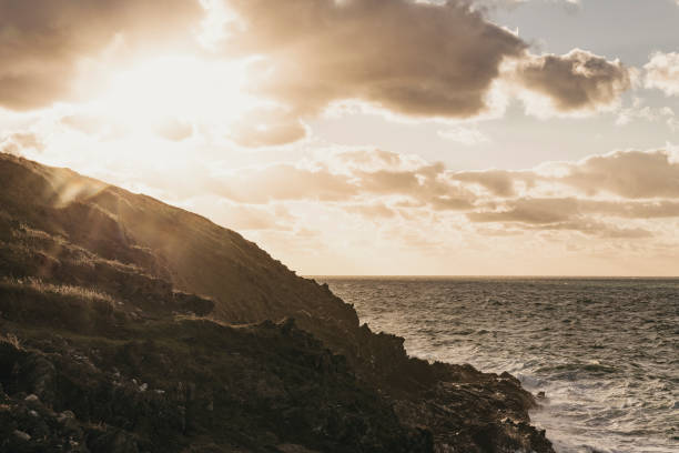 istock Sunset over the cliffs at Pentire, Newquay, Cornwall on an Autumn evening. 1062937866