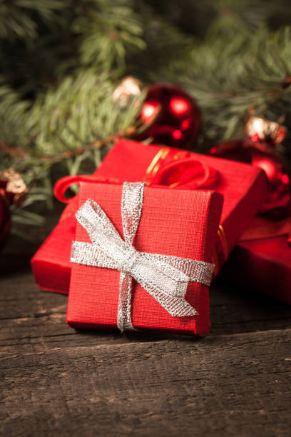 istock Luxury New Year gifts, different present boxes under Christmas tree in holiday eve, Christmastime celebration, home decorated with festive shiny balls, magic night 1062949734