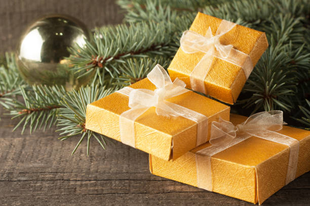 istock Luxury New Year gifts, different present boxes under Christmas tree in holiday eve, Christmastime celebration, home decorated with festive shiny balls, magic night 1062950030