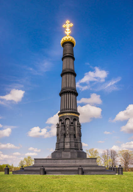 istock black monument and the bright cross burning in the sun 1062950934