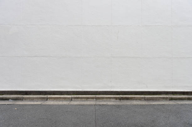 istock street wall background ,Industrial background, empty grunge urban street with warehouse brick wall 1062959920