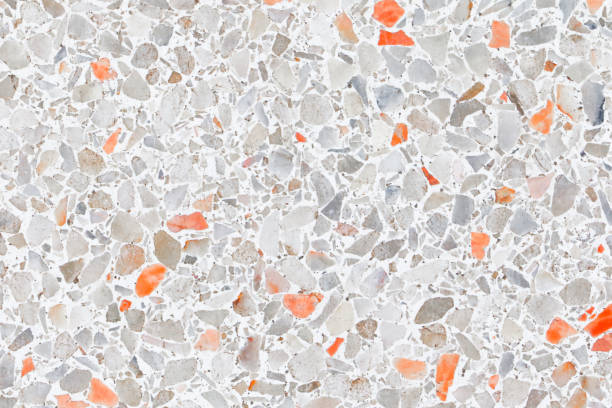 istock terrazzo flooring which has Orange rock Small or marble old. polished stone wall beautiful texture for background with copy space add text 1062960922