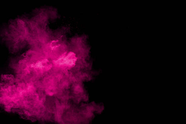 istock pink particles explosion on black background. Colorful dust splatter on black background. 1062965298