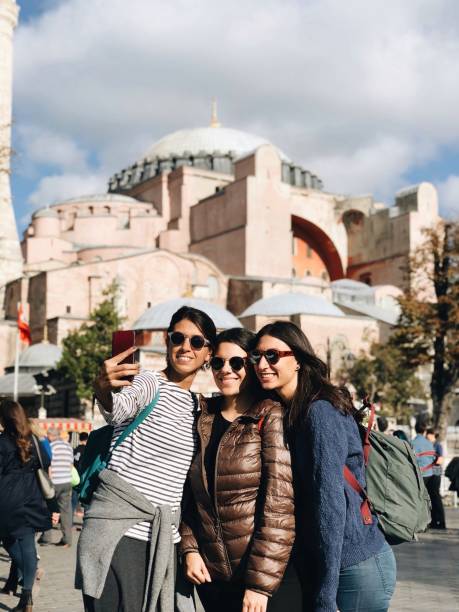 Beautiful friends taking selfies in front of Hagia Sophia stock photo