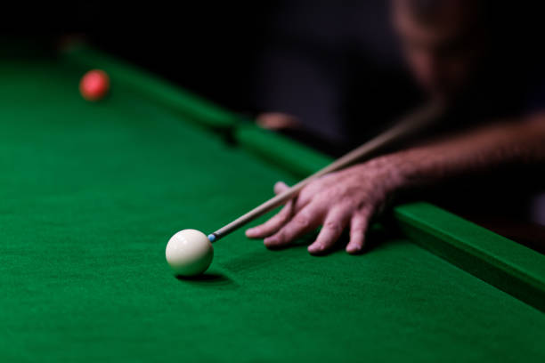 istock Man trying to hit the ball in billiard 1062969494