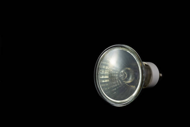 istock Halogen bulb of GU10 type on a black background 1062981308