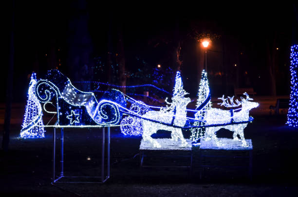 istock Outdoor decoration reindeer sleigh with blue lights. 1062983432