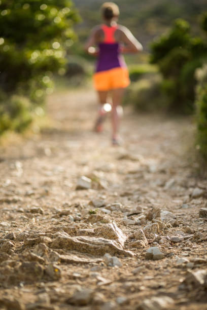 Young woman running outdoors on a lovely sunny day