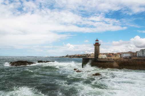 Lighthouse in Foz on Douro river. Porto, Portugal. Atlantic ocean.