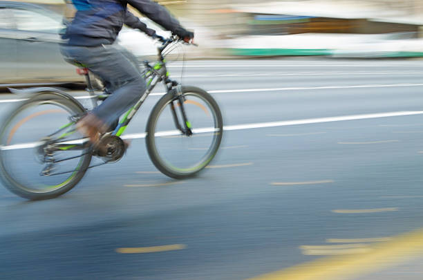 istock Cyclist rides on the road. 1062997678