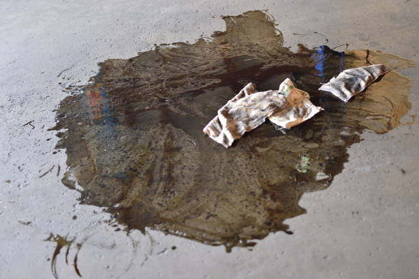 istock smeared puddle of oil with dirty rags 1063002682
