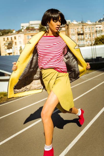 istock Precious active female uncovering her warm robe 1063011608