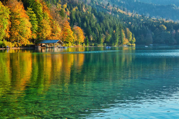 istock Beautiful blue mountain lake on a warm fall season day 1063016594