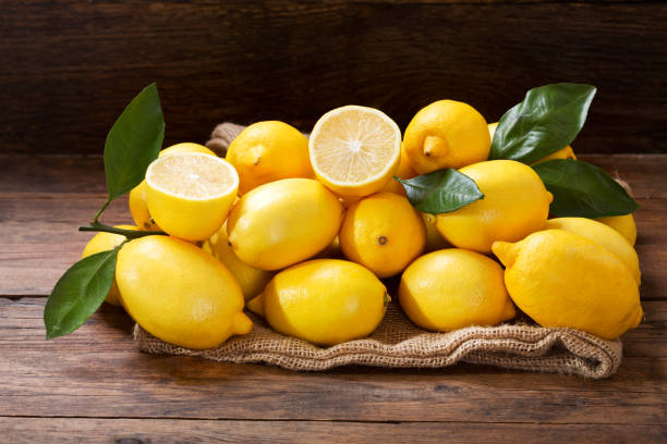 istock fresh lemons on wooden table 1063022952
