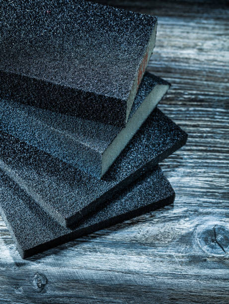 istock Polishing sanding blocks on vintage wooden board 1063025360