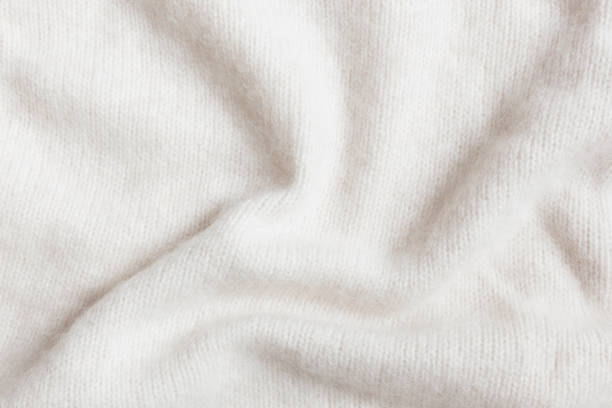 Warm Cashmere Wool Close-up Beige crumpled cashmere wool close-up blanket stock pictures, royalty-free photos & images