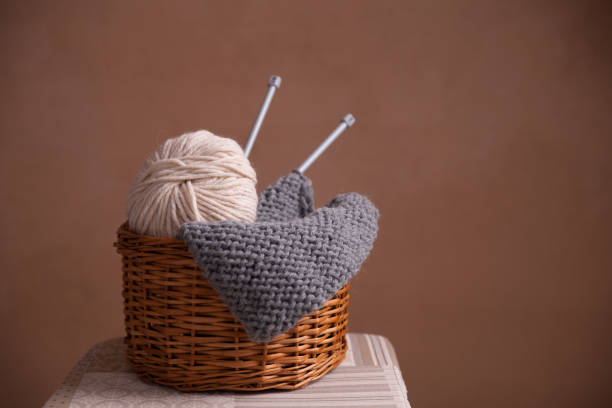 istock Basket witn yarn ball knitting and needles 1063051426