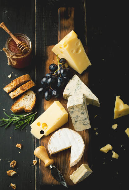 istock Assorted cheeses with grapes, nuts and rosemary 1063051546