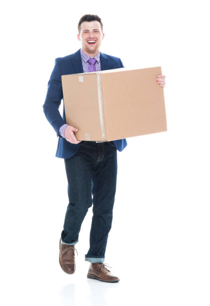 istock Businessman walking and holding a cardboard box 1063053876