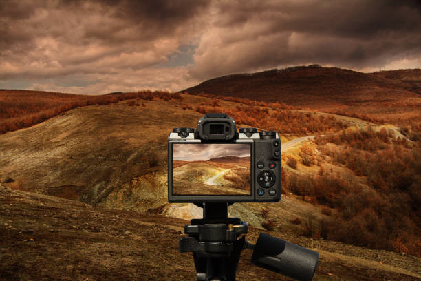 istock camera and Road in the mountains 1 1063058060