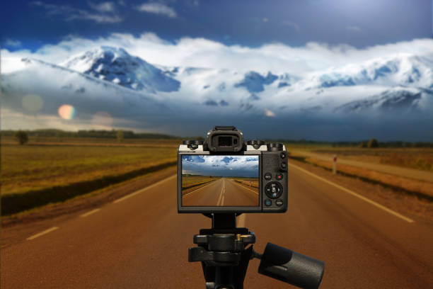Camera and  Road, mountains and stop sign