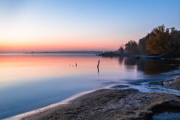 istock landscape on the water - sunset on the coast (horizon). top view. 1063062528