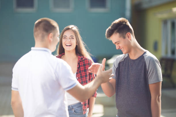 istock Small group of teenagers laughing and having fun 1063064878