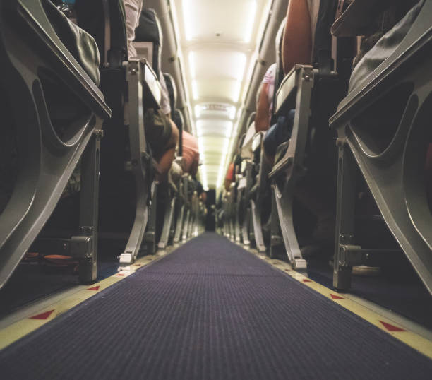 istock Interior inside of the plane with passengers. 1063070776
