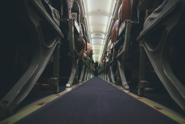 istock Interior inside of the plane with passengers. 1063070788