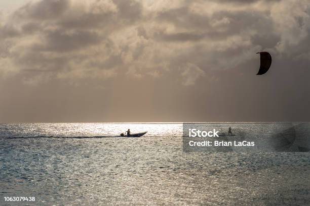 Bonaire Kite Boarding At Sunset Stock Photo - Download Image Now - Beach, Bonaire, Caribbean Netherlands