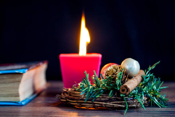 istock Christmas wreath candle and book 1063079472