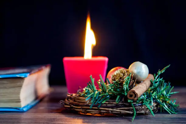 Christmas wreath candle and book