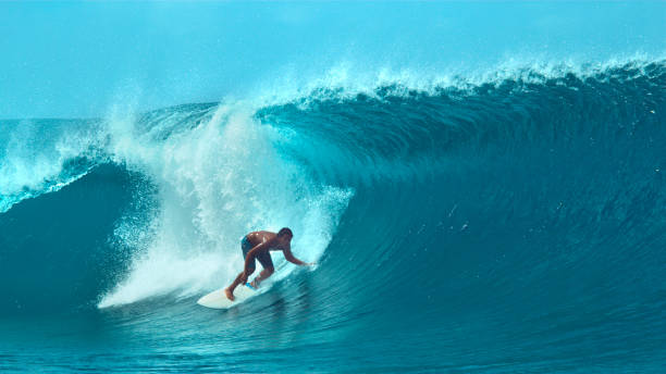 istock CLOSE UP: Extreme sportsman having fun riding a beautiful barrel ocean wave. 1063096024