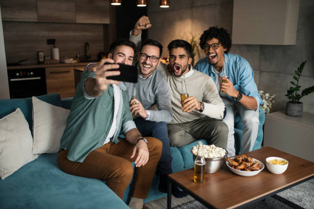 istock Group of happy friends having fun while taking a selfie with cell phone 1063097778