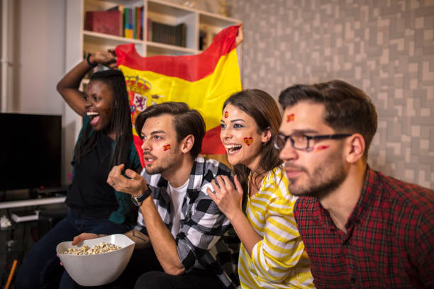 istock Spanish supporters rejoices watching television 1063101046