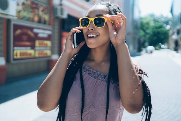 istock Tourist talking on phone and walking on street 1063103188