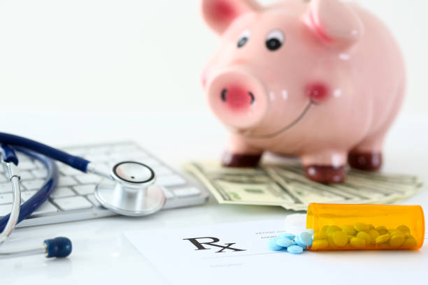 istock Blue pills fall out from orange vial to rx list 1063104598