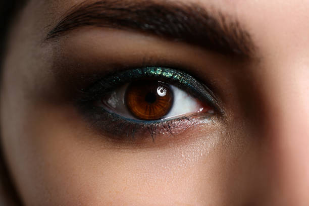 istock Female left green coloured eye extreme closeup 1063104662