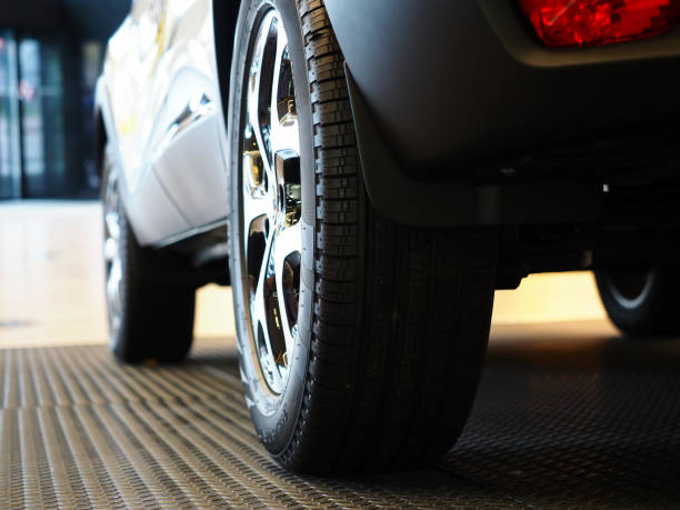istock Dark automobile standing on steel floor view from below 1063104680