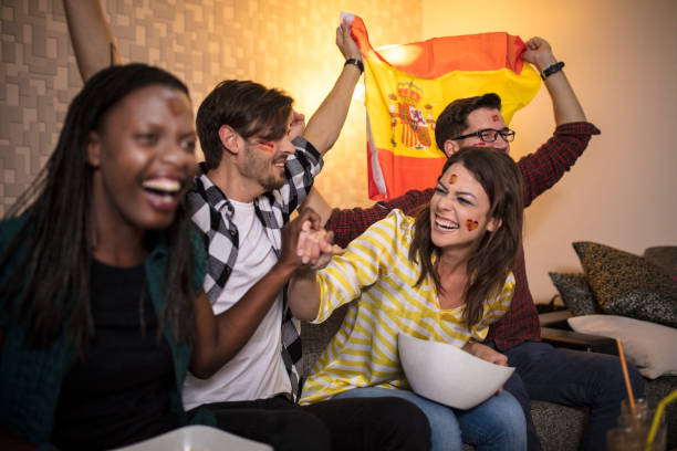 istock Spanish supporters rejoices watching television 1063112128