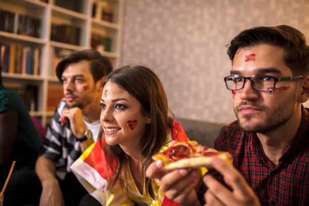 istock Supporters rejoices watching television 1063112560
