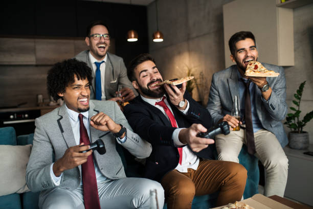 istock A group of young business man playing video games after work 1063120982